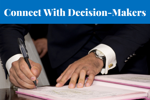 Connect With Decision-Makers - hands signing a document