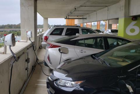 Electric vehicles charging in a garage at UCSD